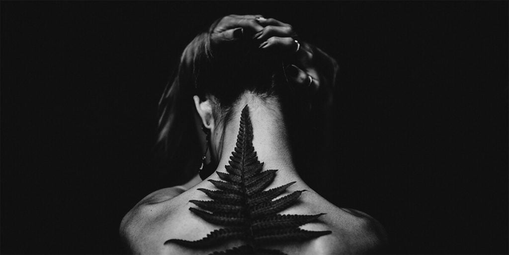 Woman with leaf on her back